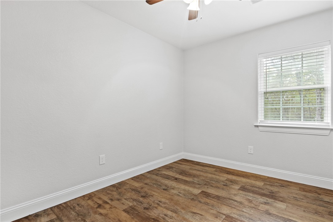 275 Woodruff Road Waco, TX 76705 - Photo 29 of 42 wooden floor in an empty room with a window