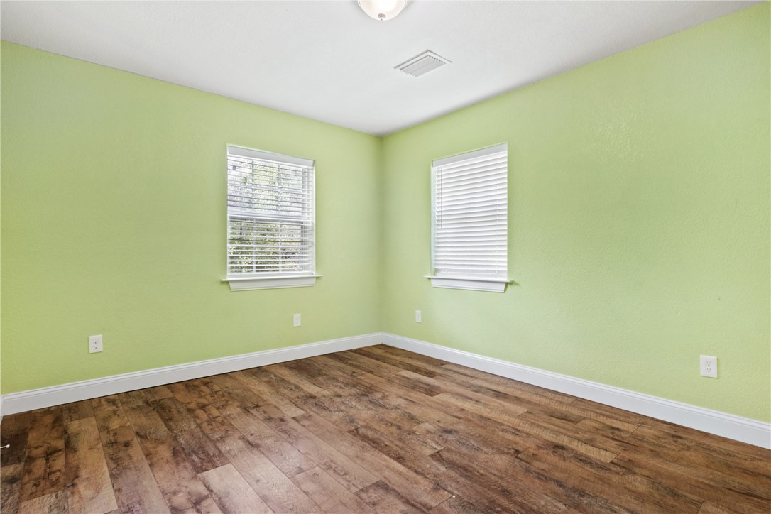 275 Woodruff Road Waco, TX 76705 - Photo 33 of 42 a view of a room with wooden floor and windows