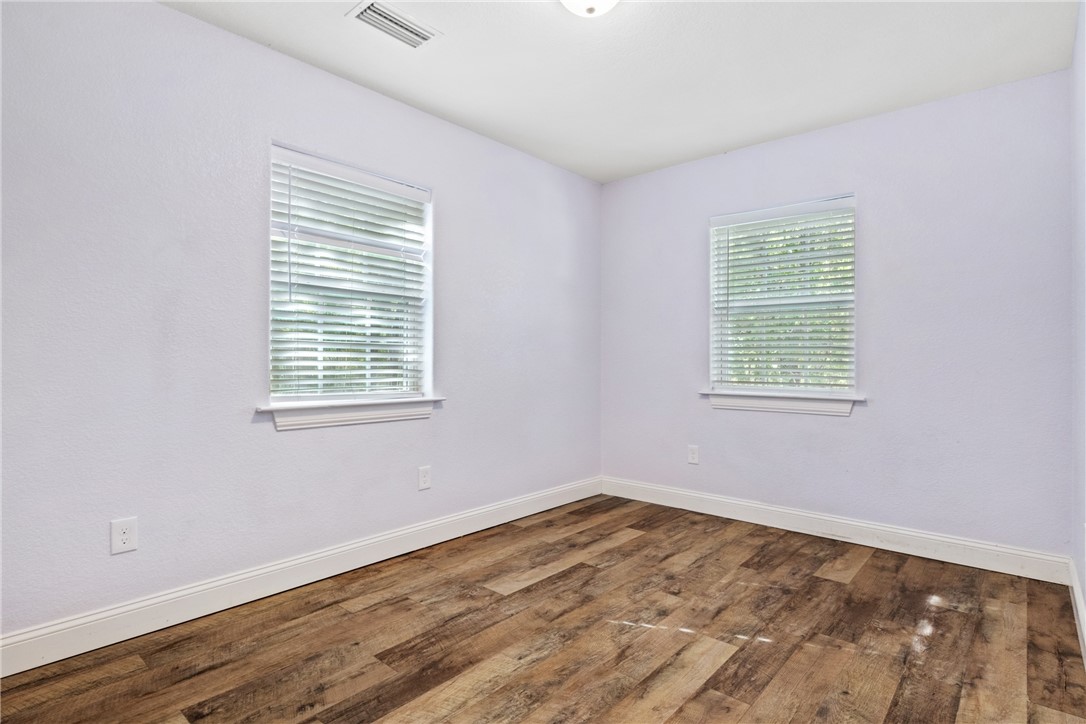 275 Woodruff Road Waco, TX 76705 - Photo 36 of 42 a view of an empty room with wooden floor and a window