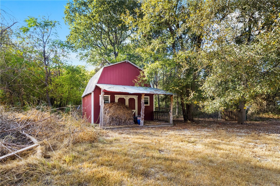 275 Woodruff Road Waco, TX 76705 - Photo 41 of 42 a view of a wooden house with a yard