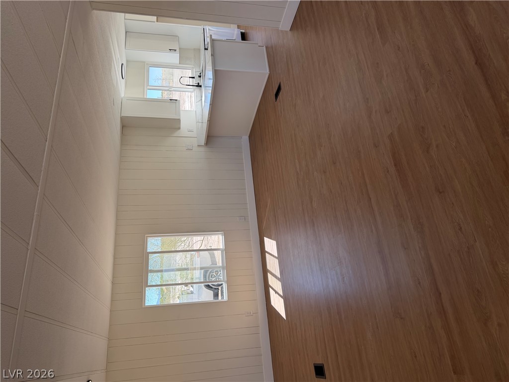 6401 Hafen Ranch Road Pahrump, NV 89061 - Photo 4 of 22 Gleaming wood floors flow throughout this open space connecting directly to the kitchen area.