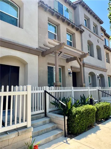 a front view of a house with a bench