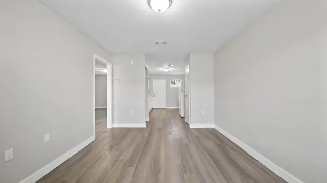a view of entryway with wooden floor