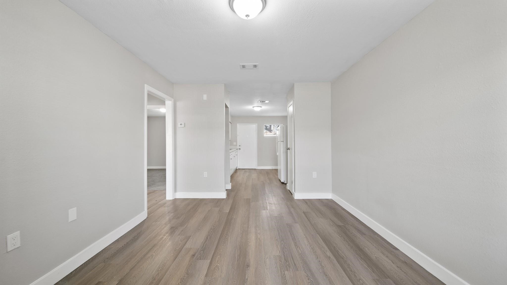 7810 Glass Street Houston, TX 77016 - Photo 3 of 12 a view of entryway with wooden floor