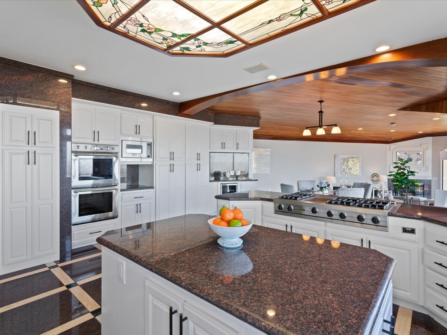 1 Lewis Ranch Road San Carlos, CA 94070 - Photo 27 of 94 a kitchen with stainless steel appliances granite countertop a sink a stove and a wooden floors