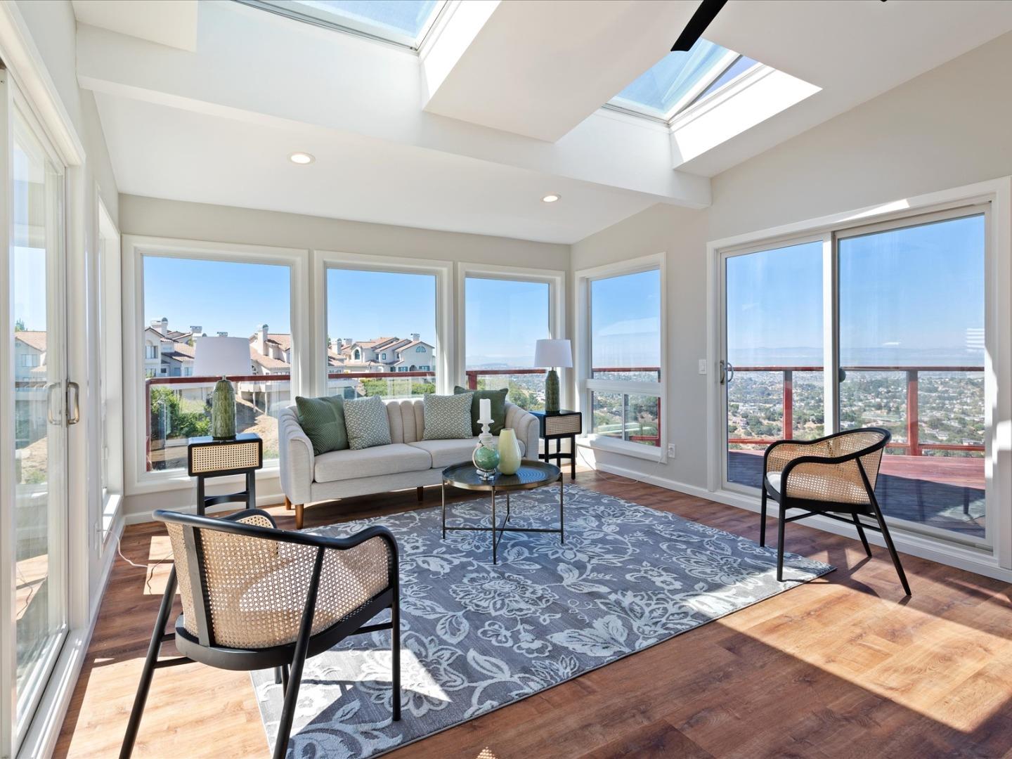 1 Lewis Ranch Road San Carlos, CA 94070 - Photo 38 of 94 a living room with furniture and a wooden floor