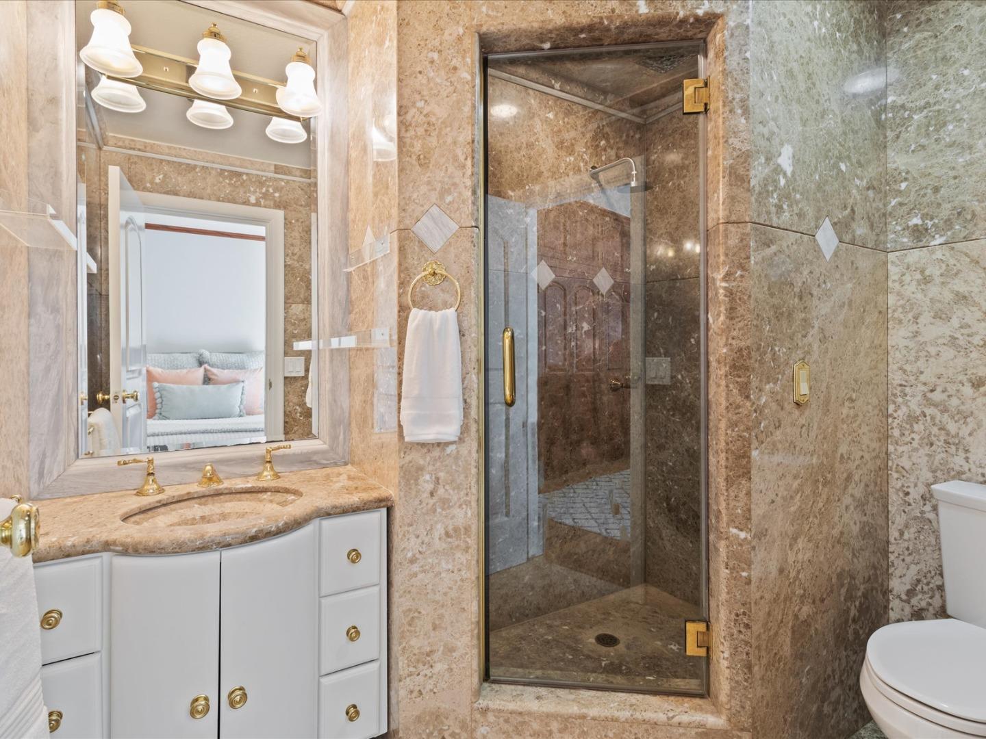 1 Lewis Ranch Road San Carlos, CA 94070 - Photo 43 of 94 a bathroom with a granite countertop sink a mirror and a shower