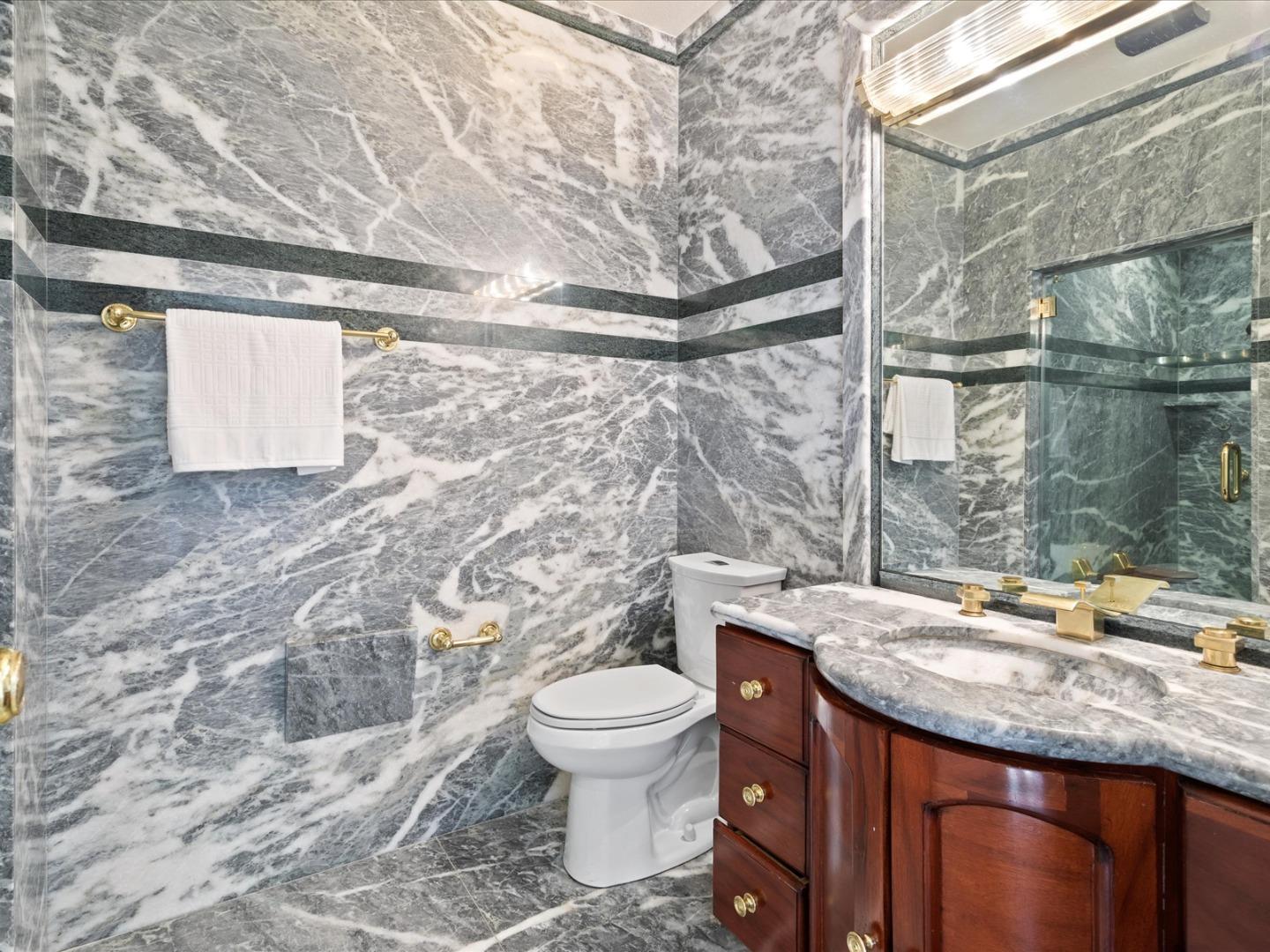 1 Lewis Ranch Road San Carlos, CA 94070 - Photo 45 of 94 a bathroom with a granite countertop sink toilet and shower