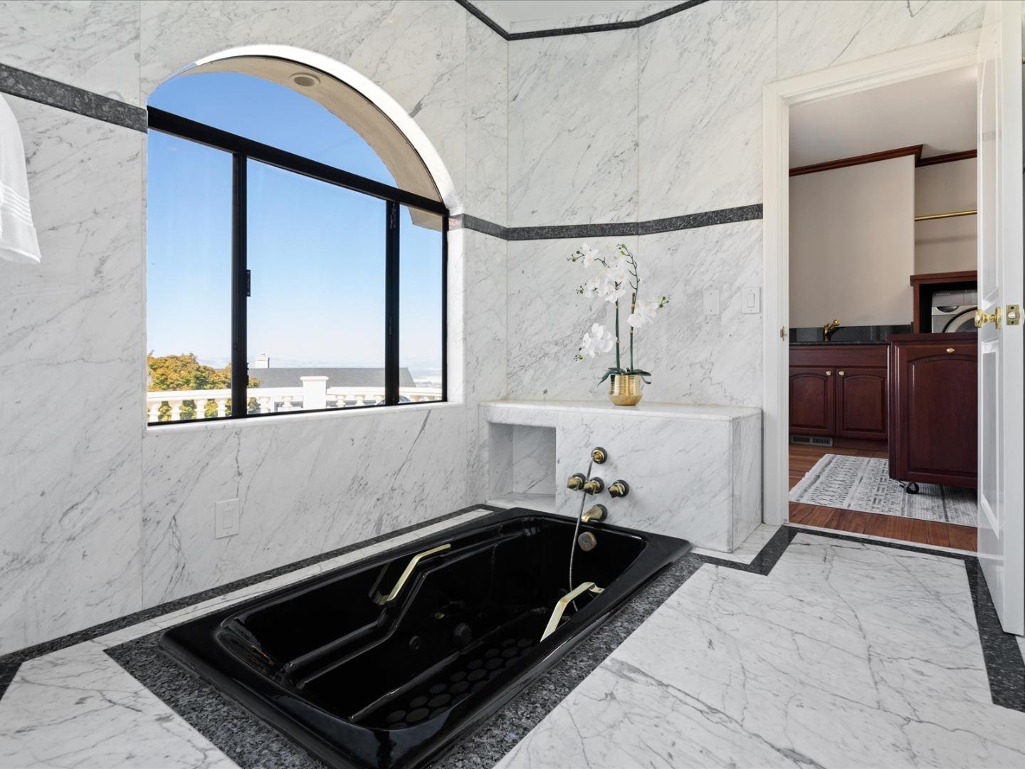 1 Lewis Ranch Road San Carlos, CA 94070 - Photo 49 of 94 a bathroom with a sink and a mirror