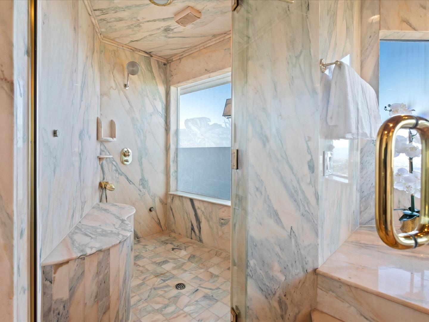 1 Lewis Ranch Road San Carlos, CA 94070 - Photo 63 of 94 a bathroom with a granite countertop shower a mirror and a sink