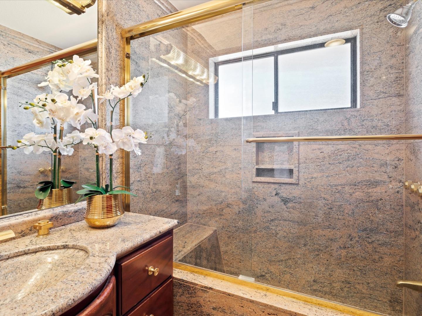 1 Lewis Ranch Road San Carlos, CA 94070 - Photo 66 of 94 a bathroom with a granite countertop sink a mirror and shower