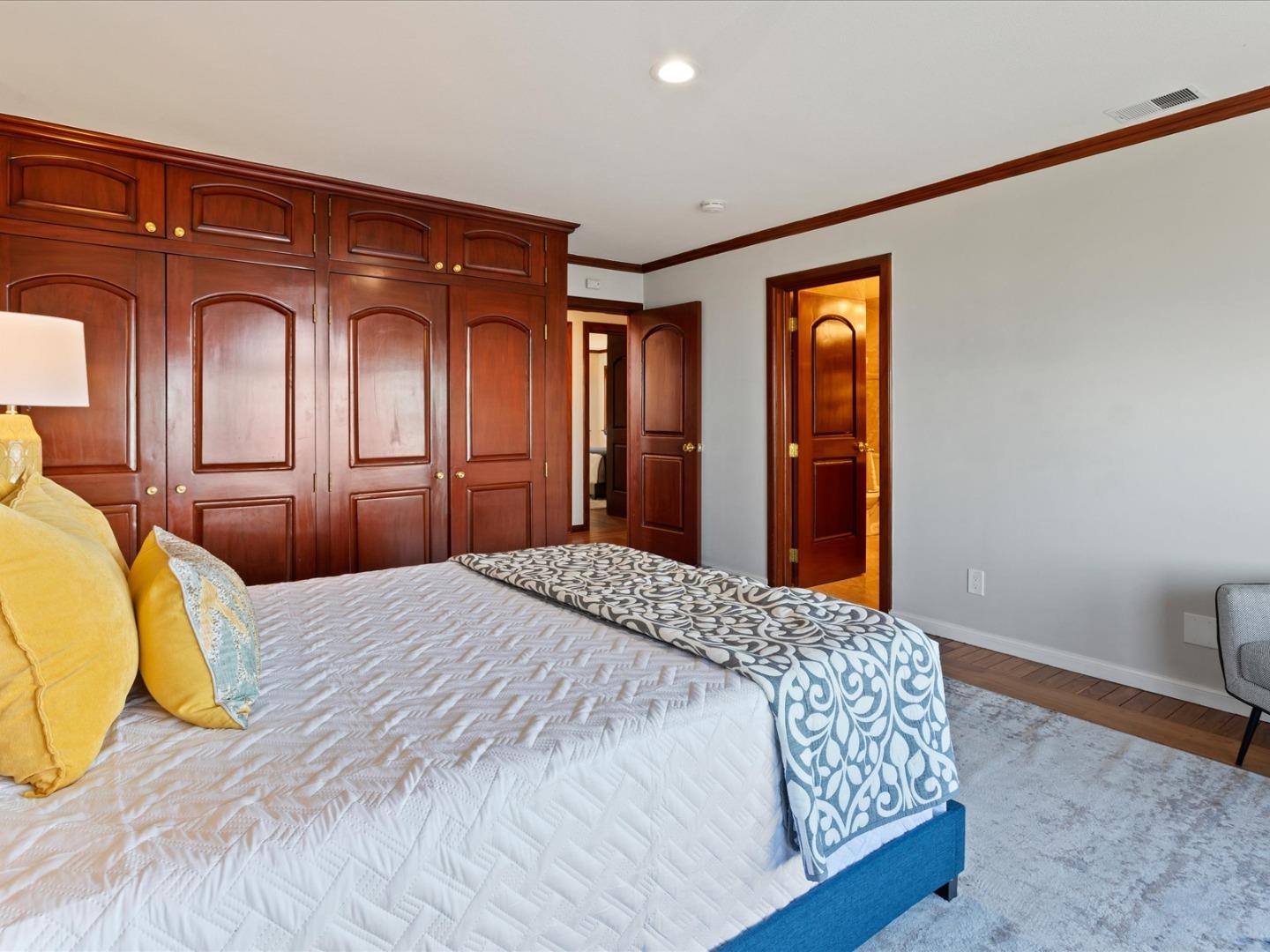 1 Lewis Ranch Road San Carlos, CA 94070 - Photo 68 of 94 a bedroom with a bed and dresser with mirror