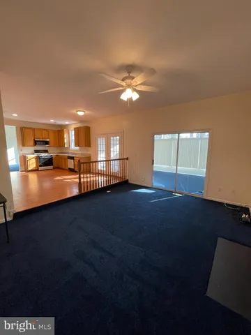 a kitchen with stainless steel appliances granite countertop a refrigerator stove microwave and sink