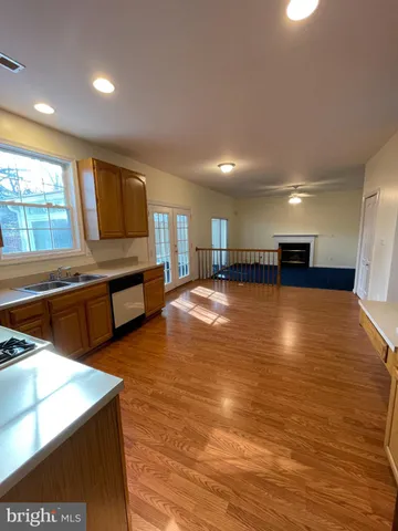 a view of a room with wooden floor and staircase