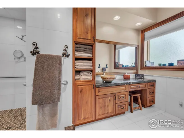 a bathroom with a sink double vanity and a mirror