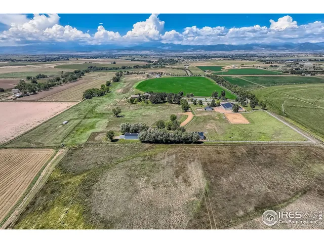 an aerial view of a house with yard lake view and mountain view