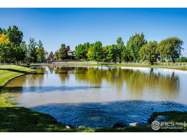 a view of a lake with houses in the back