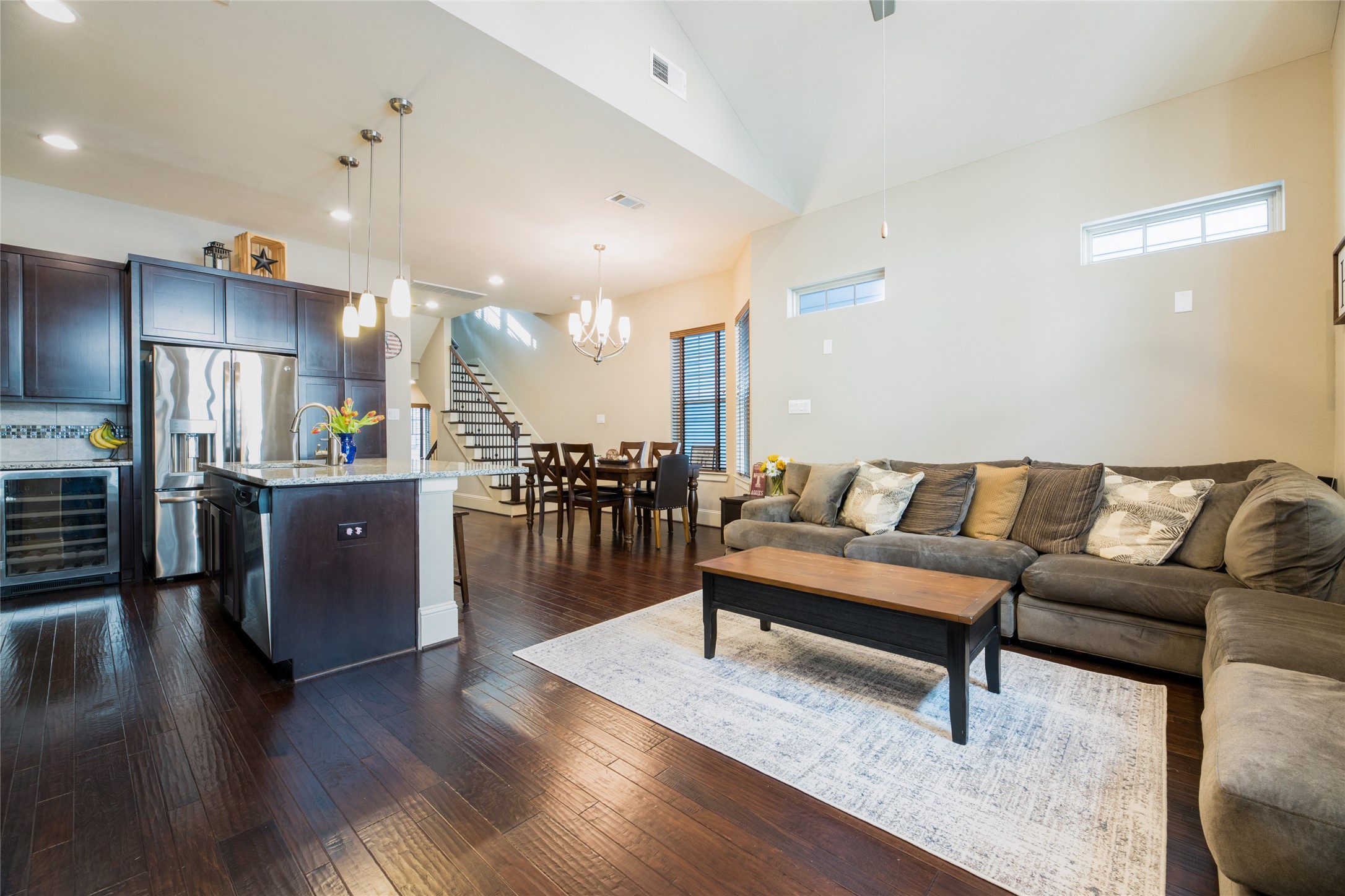 769 Waverly Street Houston, TX 77007 - Photo 35 of 35 a living room with furniture wooden floor and a kitchen view