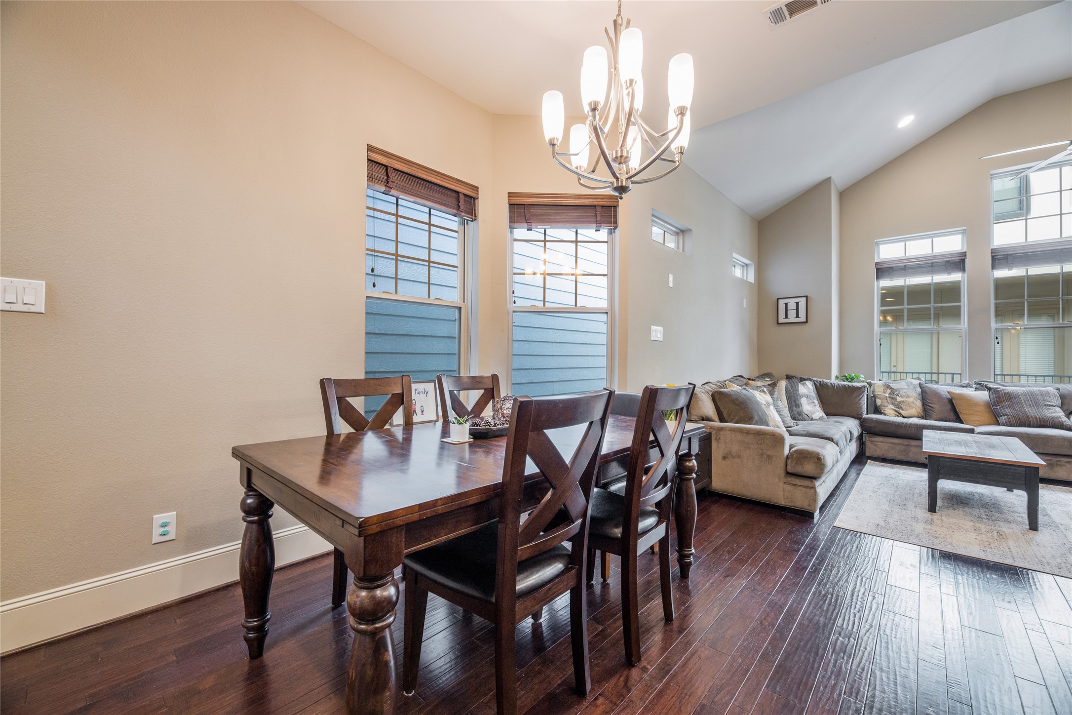 769 Waverly Street Houston, TX 77007 - Photo 16 of 35 a view of a dining room with furniture wooden floor and chandelier