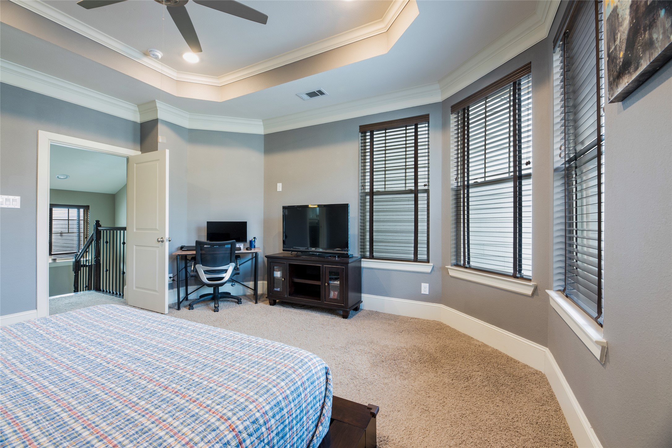769 Waverly Street Houston, TX 77007 - Photo 21 of 35 a bedroom with furniture and a flat screen tv