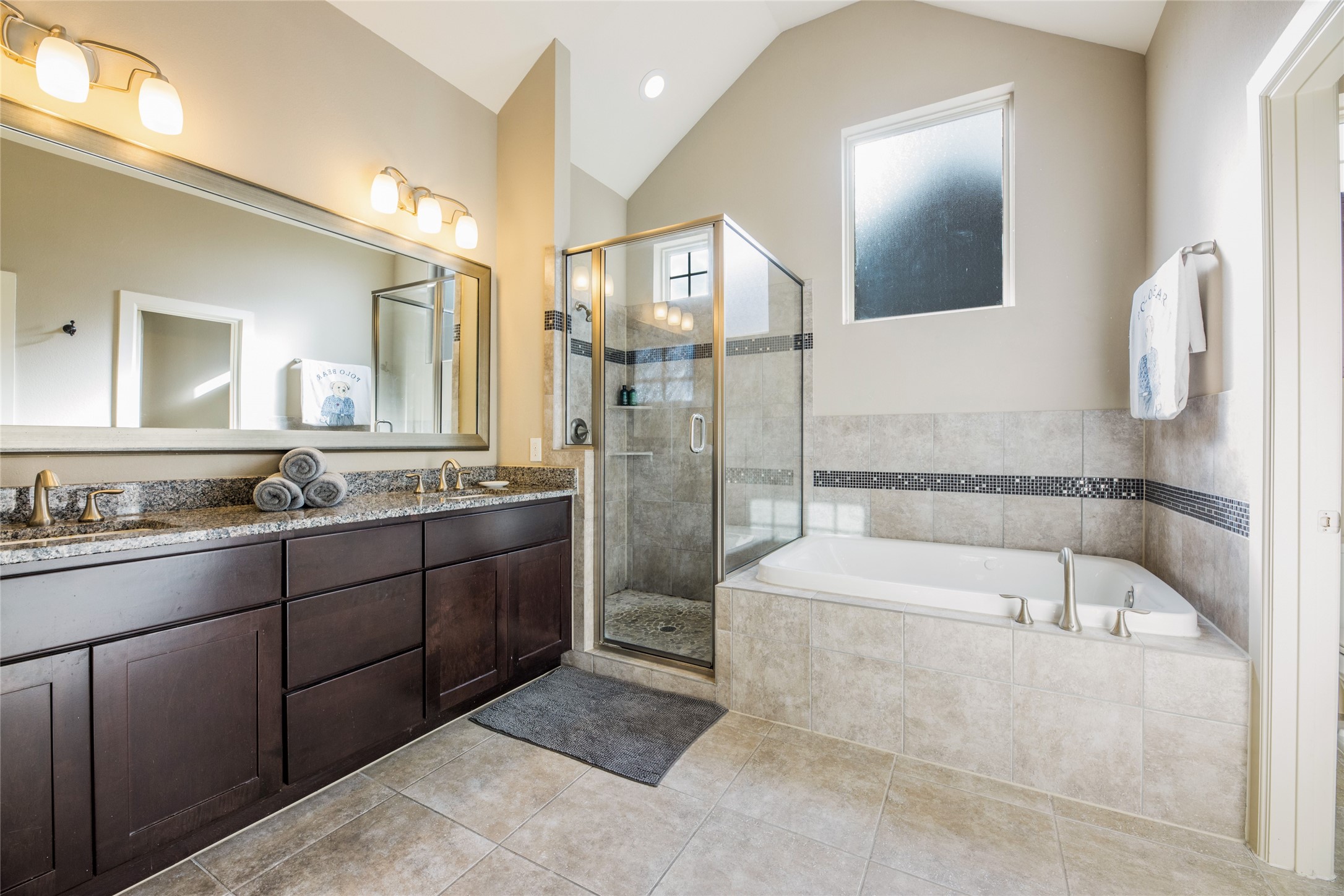 769 Waverly Street Houston, TX 77007 - Photo 22 of 35 a bathroom with a tub sink and mirror