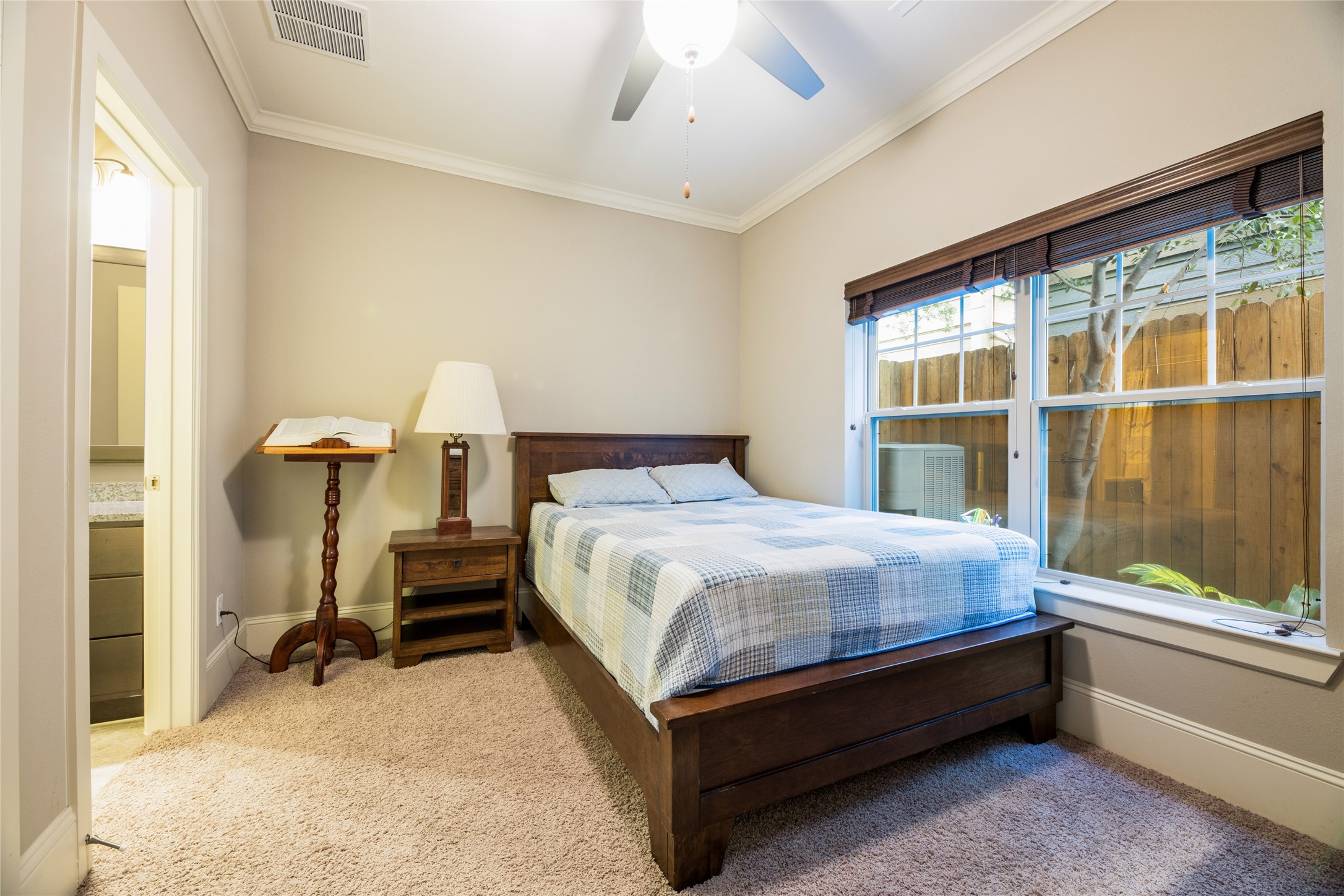 769 Waverly Street Houston, TX 77007 - Photo 5 of 35 a bedroom with a bed and window