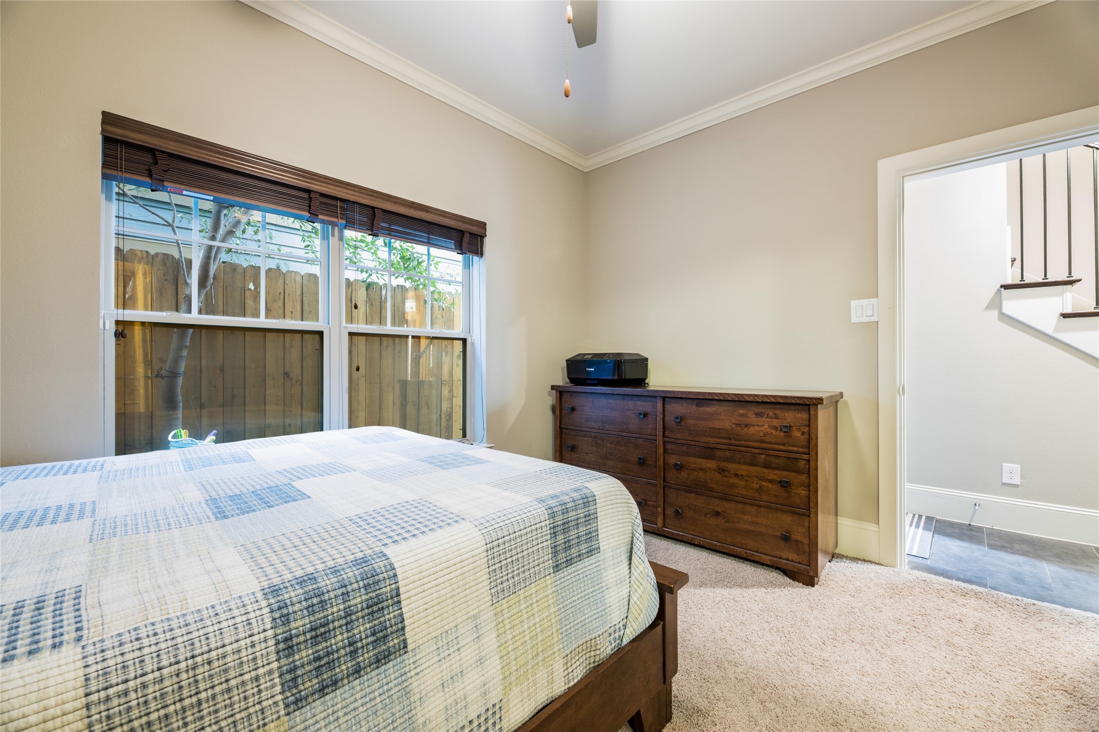 769 Waverly Street Houston, TX 77007 - Photo 6 of 35 a bedroom with a bed and a large window