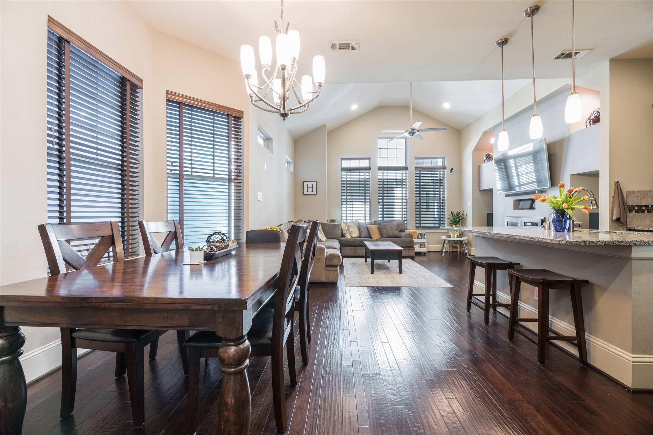 769 Waverly Street Houston, TX 77007 - Photo 34 of 35 a view of a dining room with furniture a chandelier and wooden floor