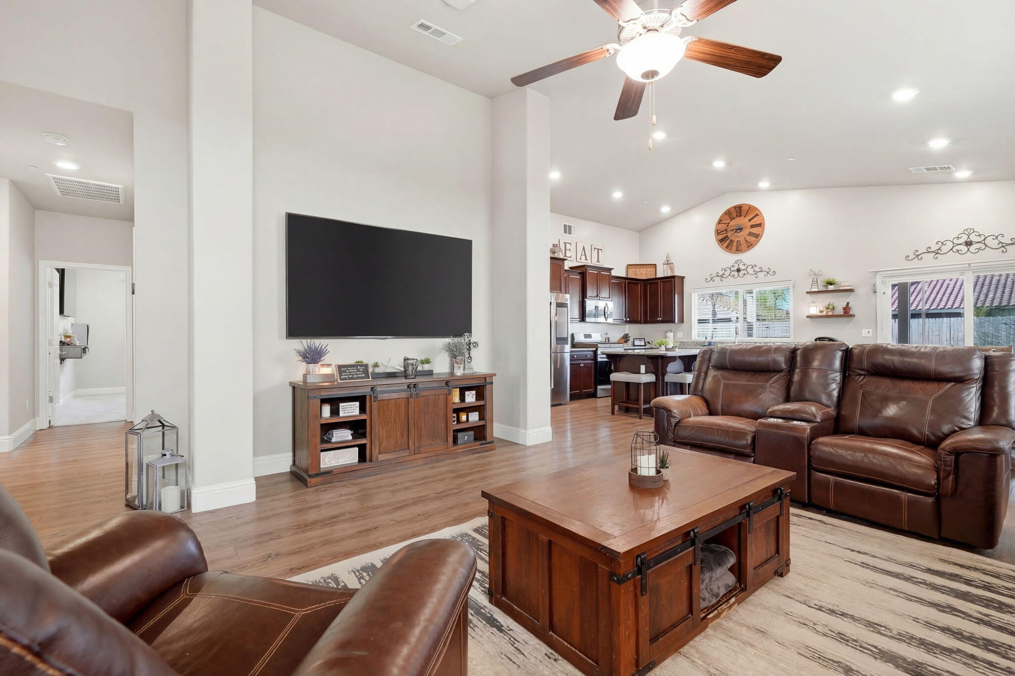 756 Strada Street Lemoore, CA 93245 - Photo 8 of 53 a living room with furniture and a flat screen tv