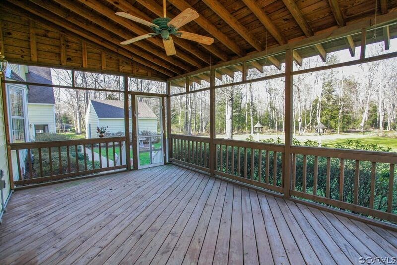 12907 Rivers Bend Road Chester, VA 23836 - Photo 16 of 43 Large screened-on porch with ceiling fan and view