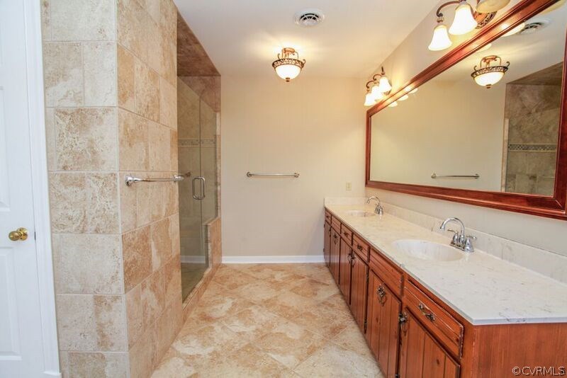 12907 Rivers Bend Road Chester, VA 23836 - Photo 23 of 43 Master Bath vanities and shower.
