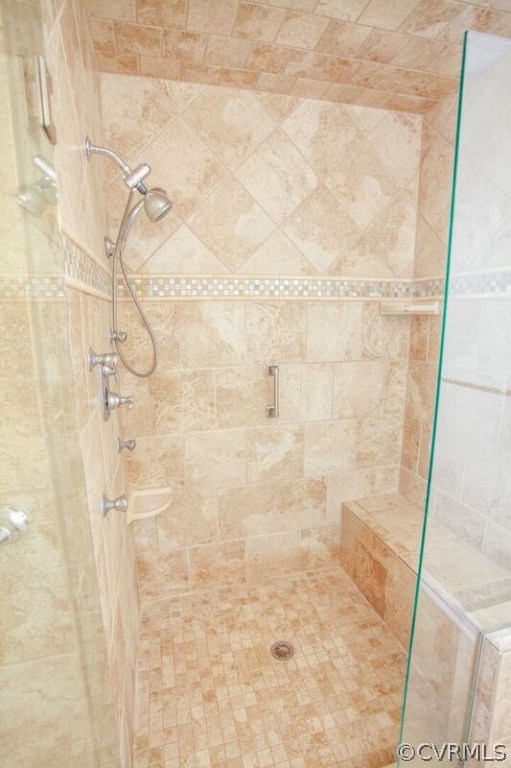 12907 Rivers Bend Road Chester, VA 23836 - Photo 25 of 43 Master Shower tiled to ceiling with bench and jets