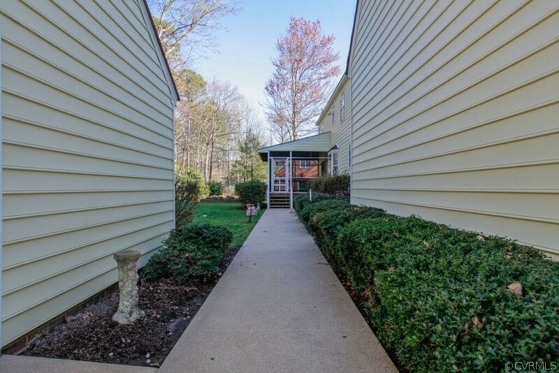 12907 Rivers Bend Road Chester, VA 23836 - Photo 33 of 43 Walkway from screened in porch to shop and garage.