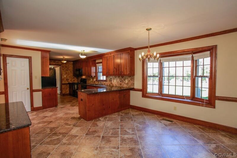 12907 Rivers Bend Road Chester, VA 23836 - Photo 7 of 43 Huge kitchen and eat-in area featuring granite cou