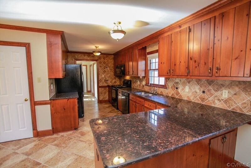 12907 Rivers Bend Road Chester, VA 23836 - Photo 10 of 43 Another close-up of kitchen and door to walk-in pa