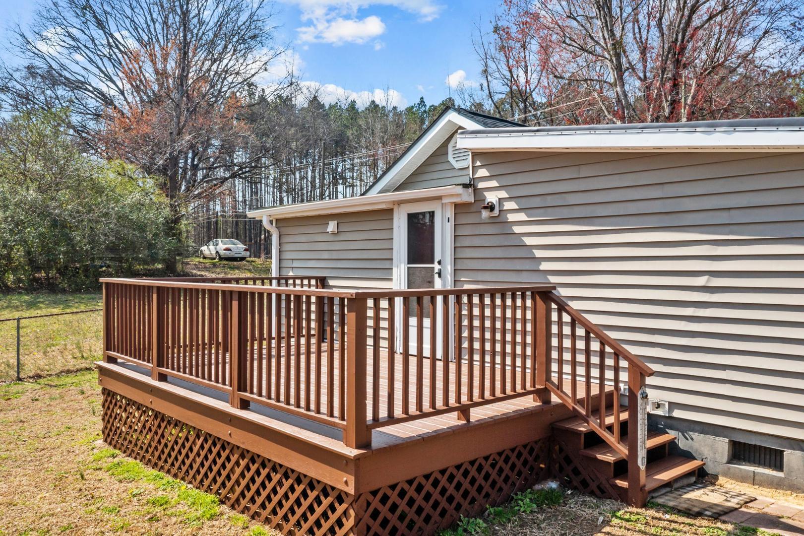 2005 Doc Nichols Road Durham, NC 27703 - Photo 12 of 37 a view of a roof deck with wooden floor and fence