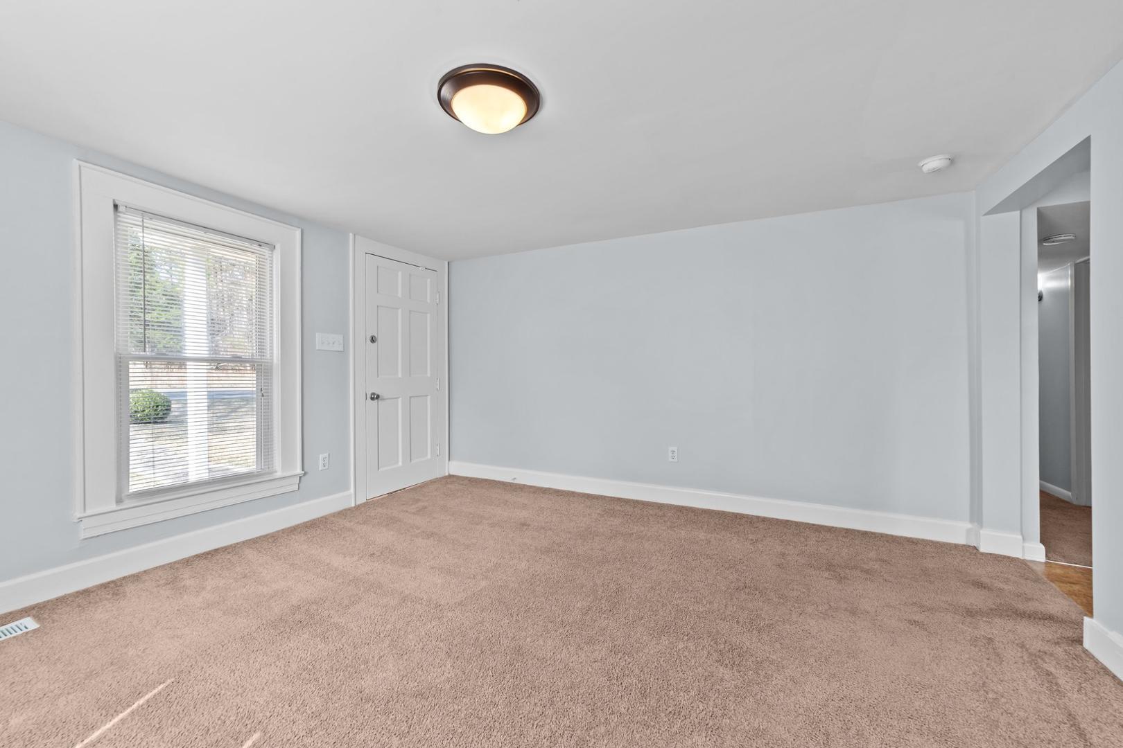 2005 Doc Nichols Road Durham, NC 27703 - Photo 26 of 37 an empty room with windows and closet