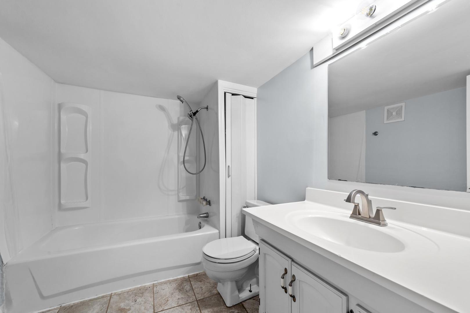 2005 Doc Nichols Road Durham, NC 27703 - Photo 29 of 37 a bathroom with a sink toilet and shower