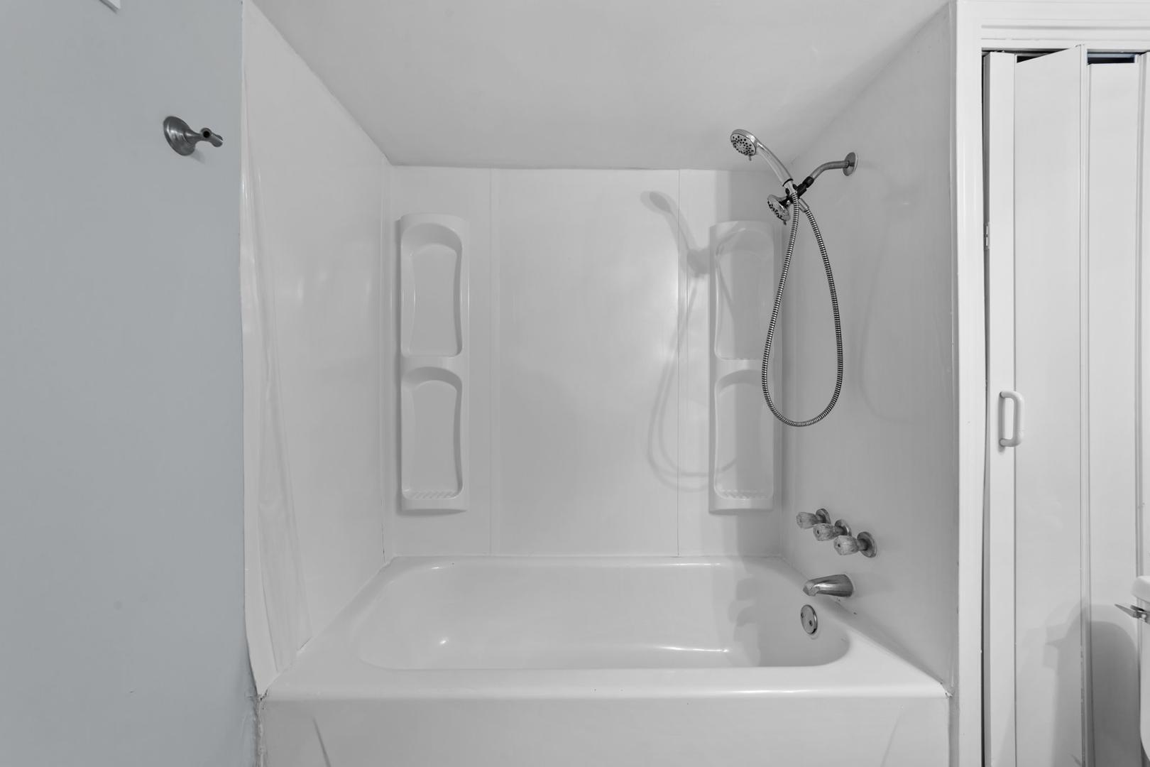 2005 Doc Nichols Road Durham, NC 27703 - Photo 30 of 37 a bathroom with a bath tub and a shower