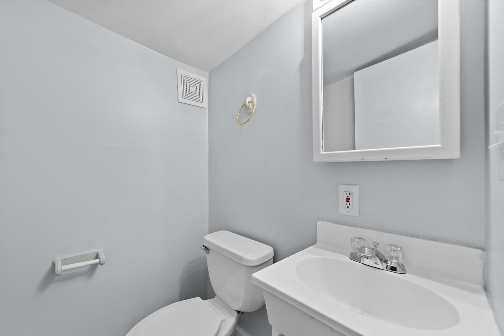 2005 Doc Nichols Road Durham, NC 27703 - Photo 31 of 37 a white toilet sitting next to a bathroom sink