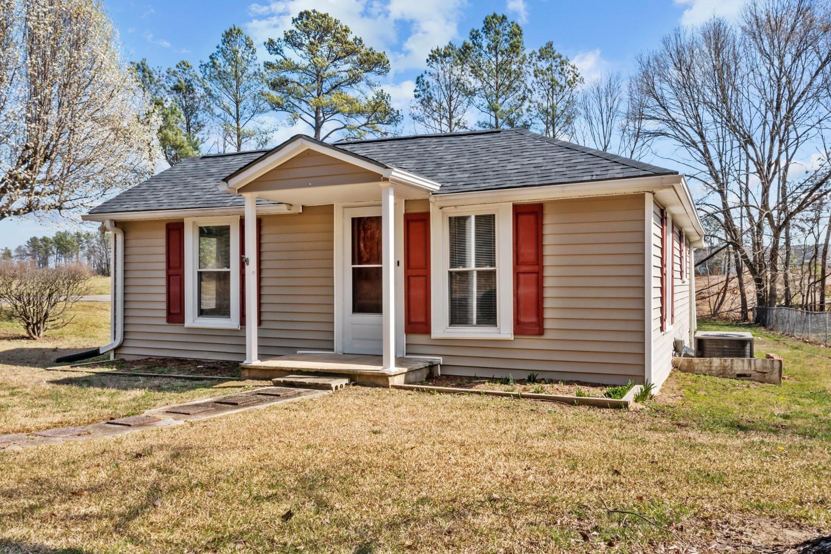 2005 Doc Nichols Road Durham, NC 27703 - Photo 4 of 37 a front view of a house with a yard