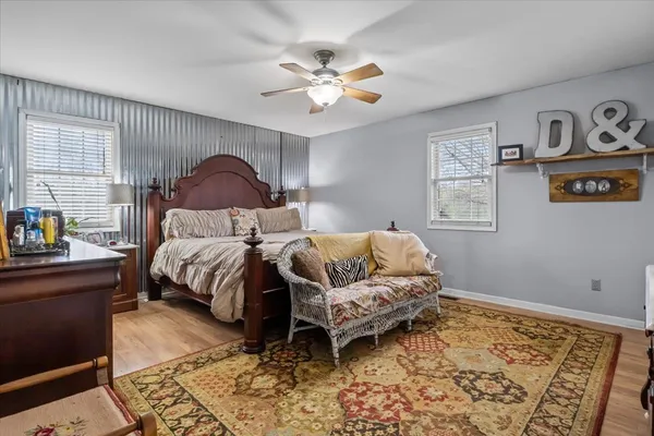 a bedroom with a bed and a chandelier