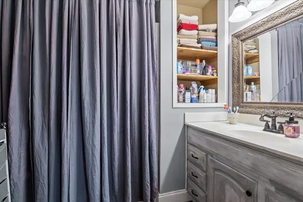 a bathroom with a sink and a mirror