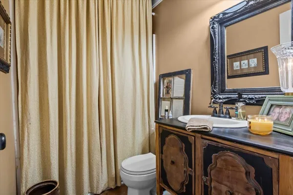 a bedroom with a bed window and couch