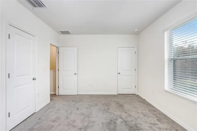 a view of an empty room and window