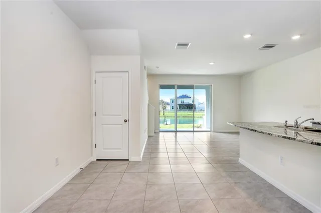 a view of a kitchen with a sink and cabinets