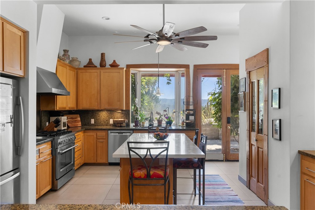 1010-1012 Upper Los Berros Road Nipomo, CA 93444 - Photo 11 of 75 a kitchen with a refrigerator a stove a sink and dishwasher