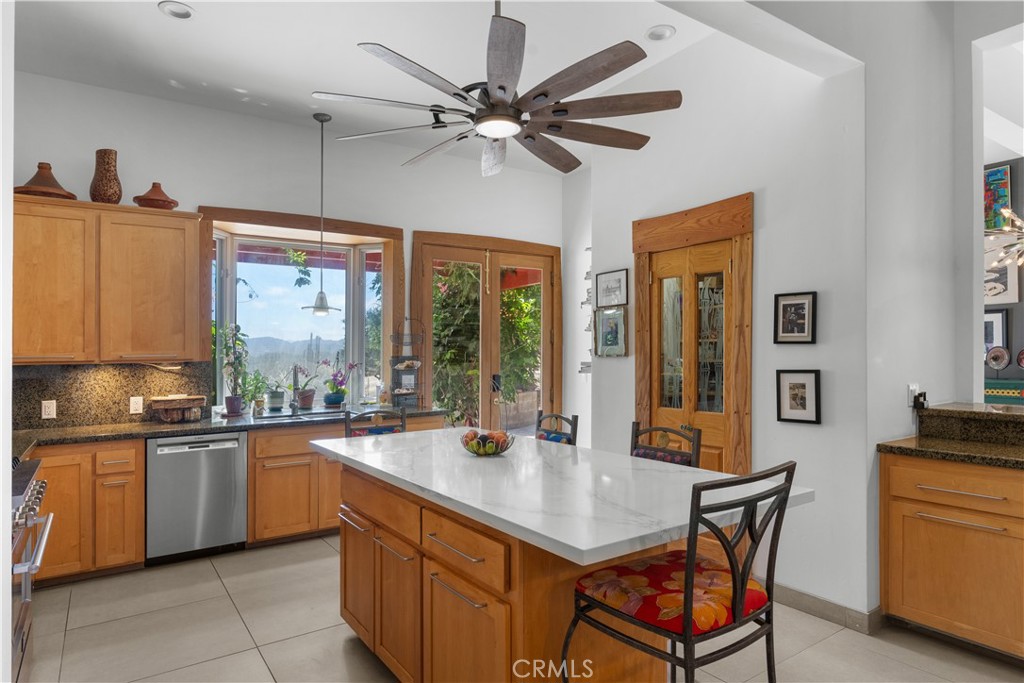 1010-1012 Upper Los Berros Road Nipomo, CA 93444 - Photo 13 of 75 a kitchen with a sink refrigerator and cabinets