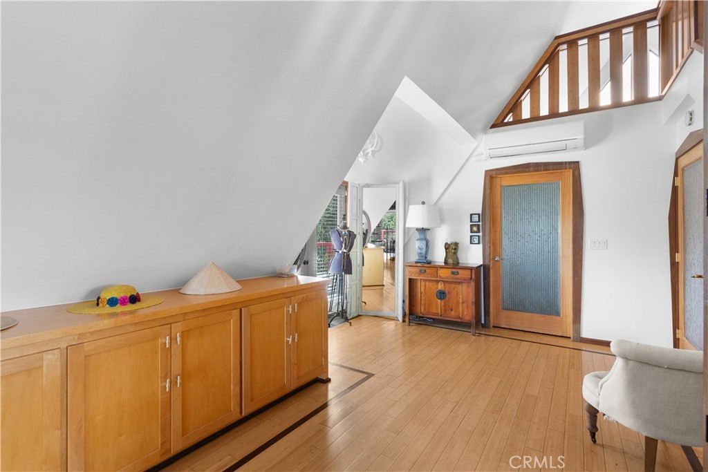 1010-1012 Upper Los Berros Road Nipomo, CA 93444 - Photo 25 of 75 a living room with a baby crib furniture and a wooden floor