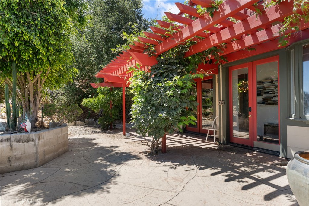 1010-1012 Upper Los Berros Road Nipomo, CA 93444 - Photo 41 of 75 a view of a patio with a table and chairs and potted plants